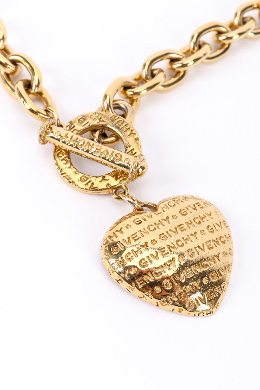 Heart charm necklace by Givenchy on white background heart close @recessla