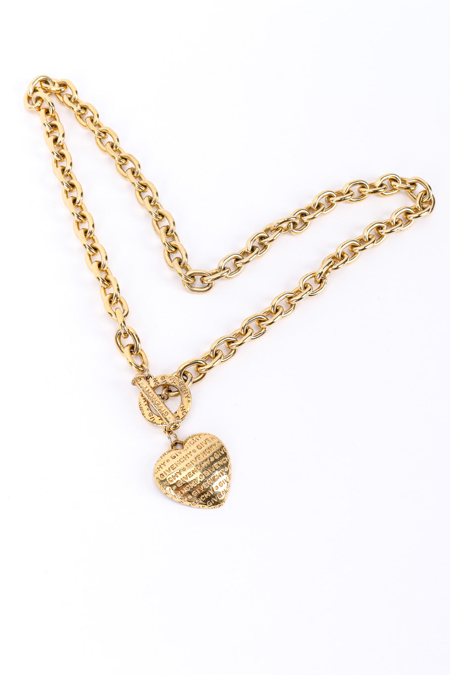 Heart charm necklace by Givenchy on white background in heart shape @recessla