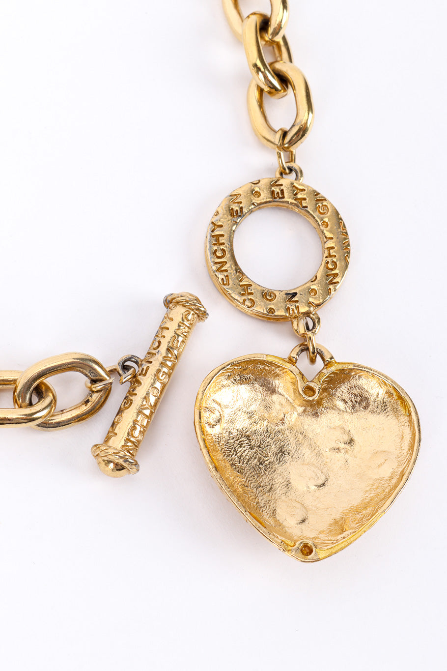Heart charm necklace by Givenchy on white background inside heart @recessla