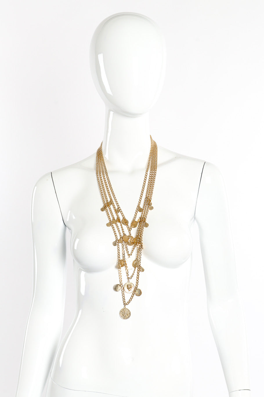 Coin pendant necklace by Goldette on white background on mannequin @recessla