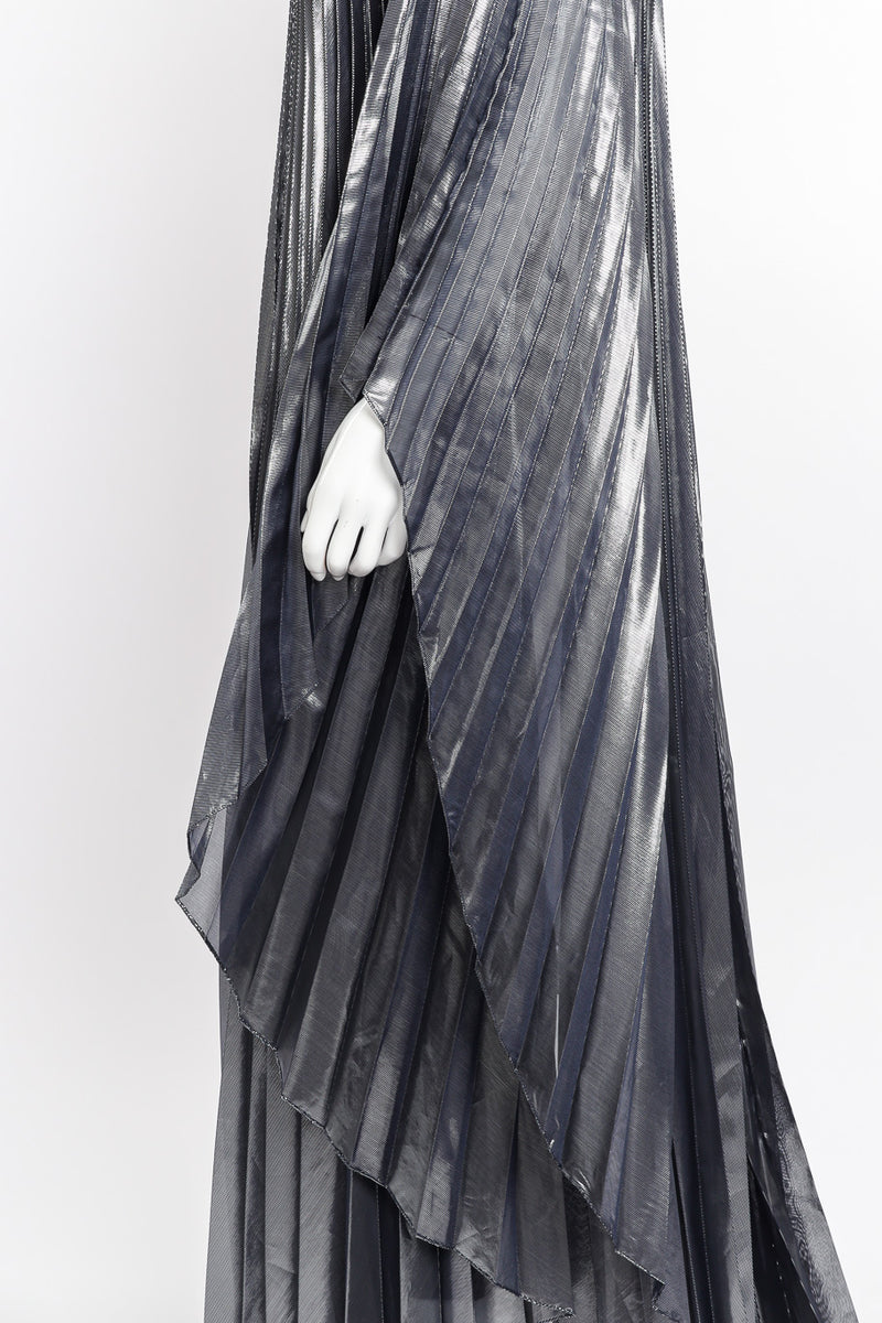 Metallic pleated caftan and bodysuit by Halston on mannequin hand close @recessla