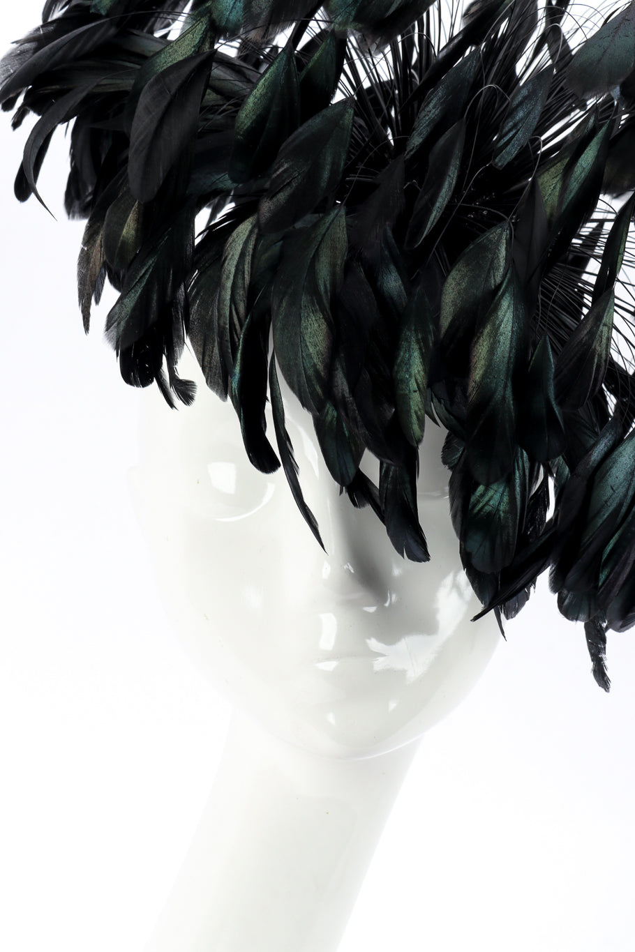 Raven Feather Fascinator Hat by Winkelman's on mannequin head face close with feathers draped over @recessla