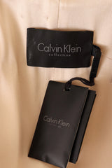 trench coat by Calvin Klein on mannequin label @ Recess LA