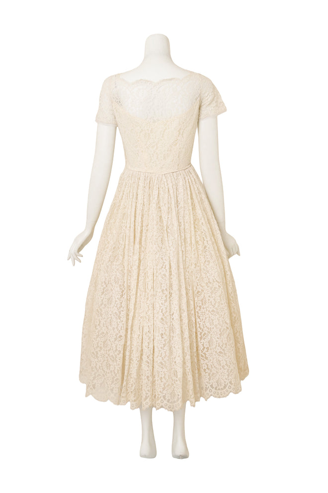 Lace Tea Length Wedding Dress on back of mannequin @ Recess LA