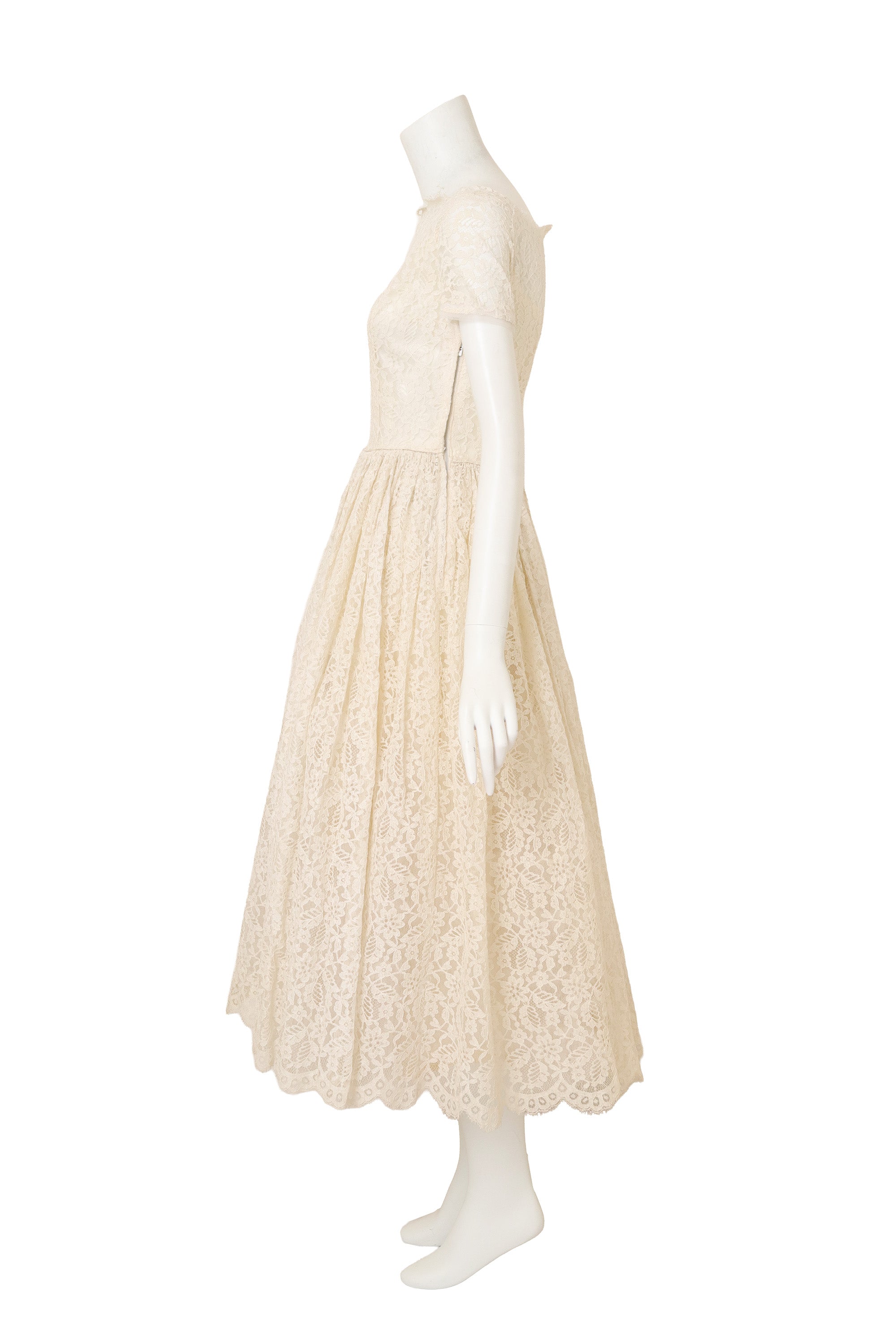 Lace Tea Length Wedding Dress on side of mannequin @ Recess LA