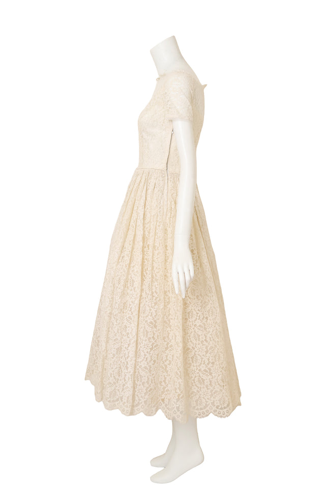 Lace Tea Length Wedding Dress on side of mannequin @ Recess LA