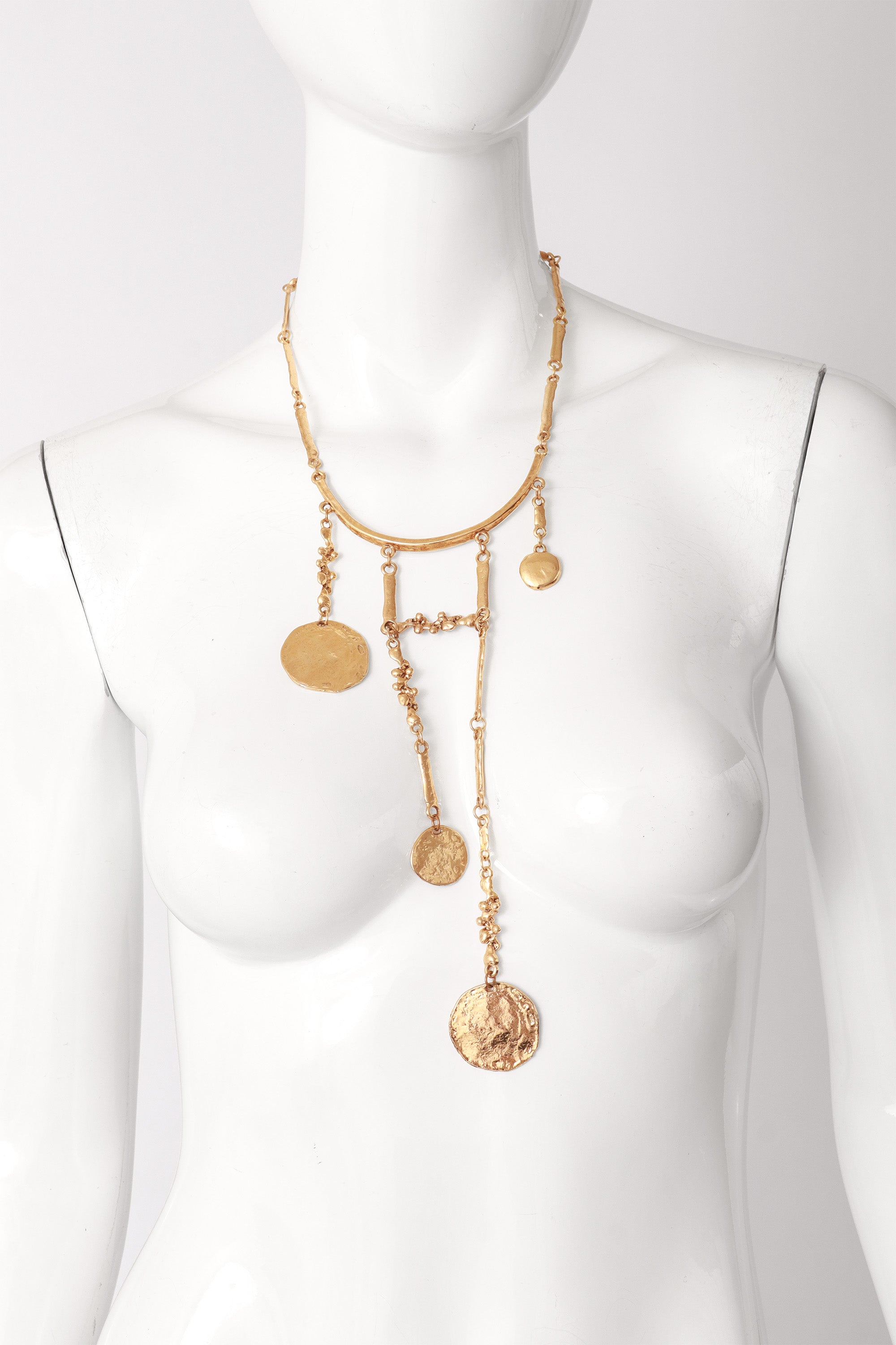 Hammered metal bib necklace on mannequin @ Recess LA