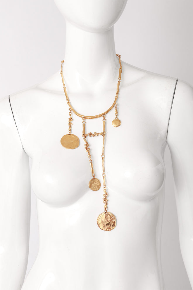 Hammered metal bib necklace on mannequin @ Recess LA