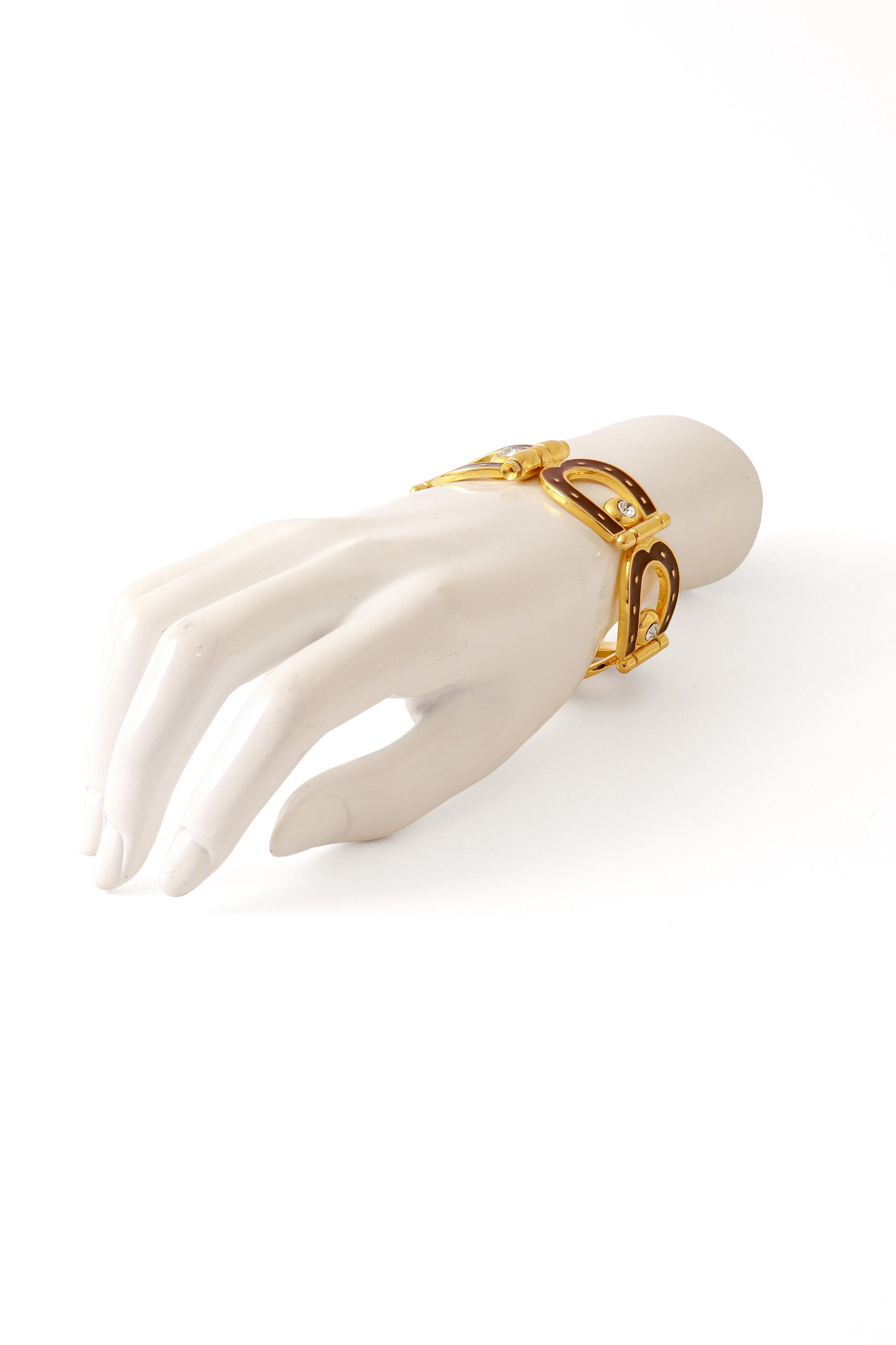 enameled horseshoe bracelet on mannequin hand @ Recess LA
