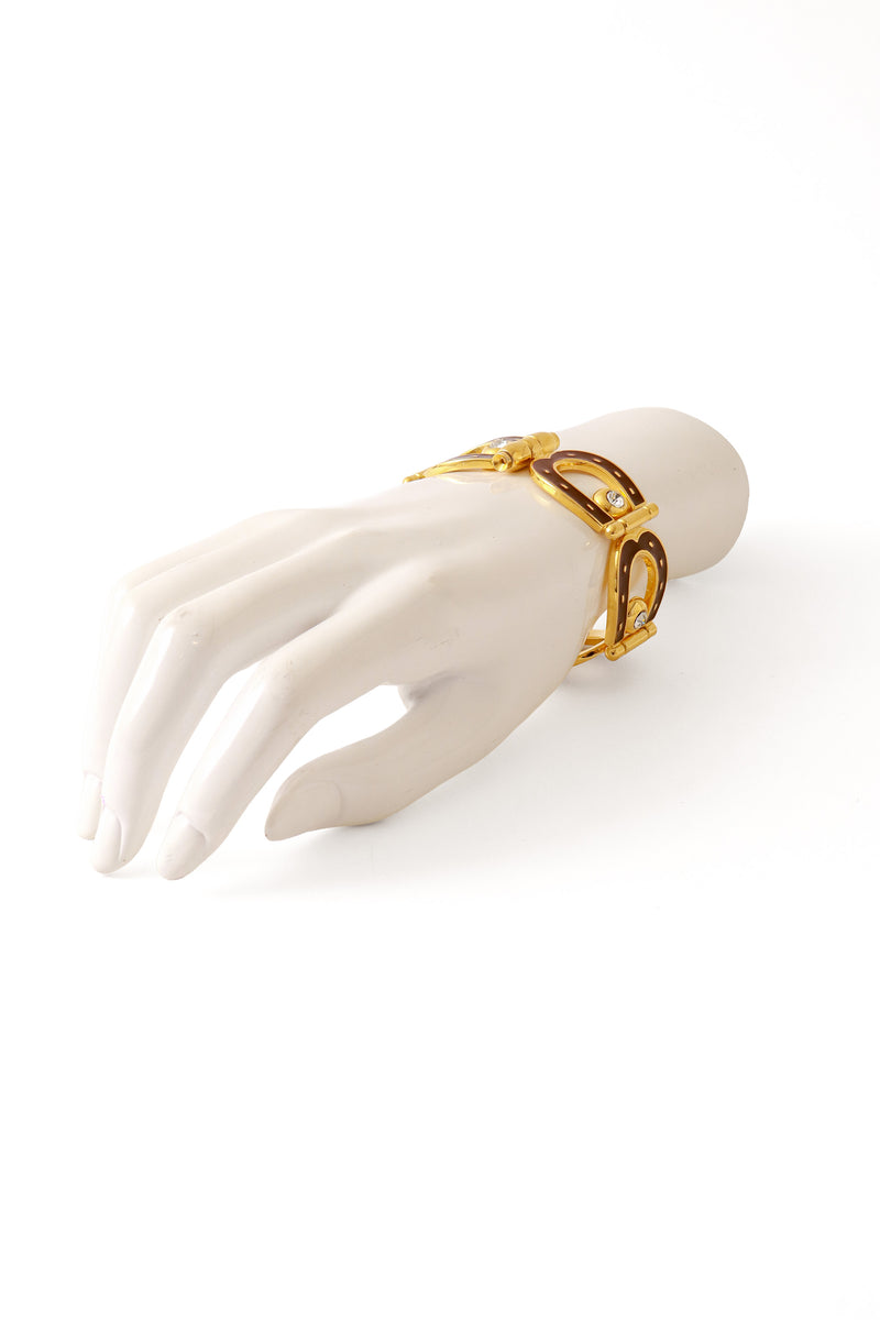 enameled horseshoe bracelet on mannequin hand @ Recess LA
