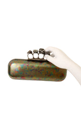 Oil Slick Knuckle Clutch by Alexander McQueen on mannequin hand @ Recess LA