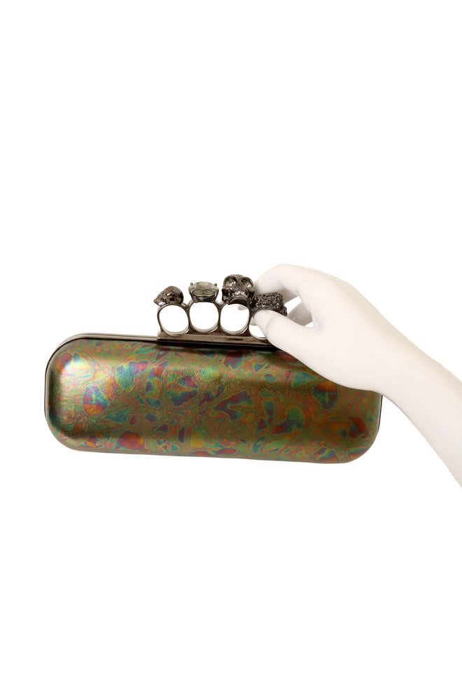 Oil Slick Knuckle Clutch by Alexander McQueen on mannequin hand @ Recess LA