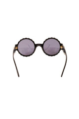 scalloped sunglasses by Chanel inside lenses @ Recess LA