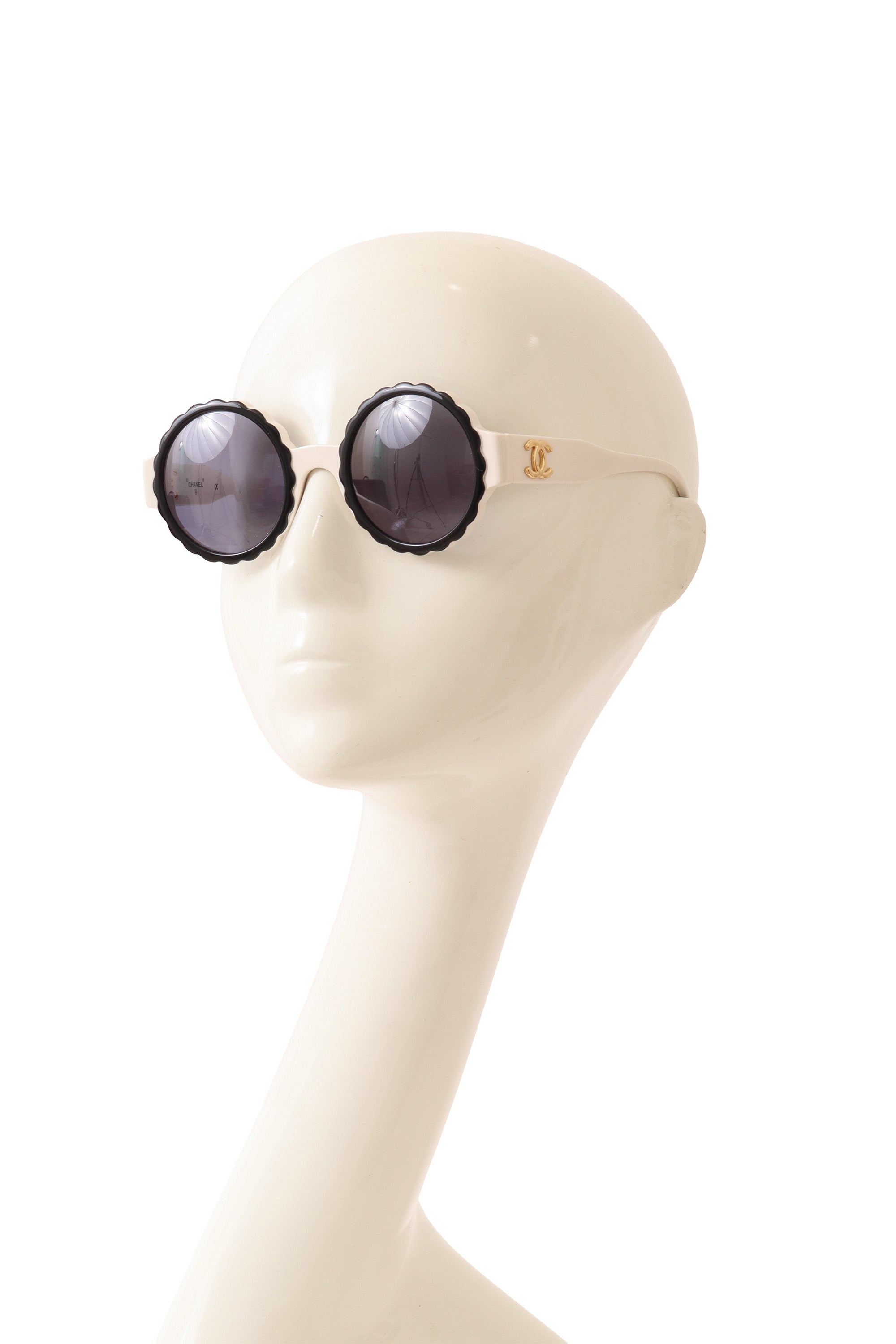 scalloped sunglasses by Chanel on mannequin side @ Recess LA