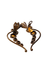 Bronze flower cuff crystal earrings by Nadir on mannequin back side @ Recess LA 