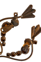 Bronze flower cuff crystal earrings by Nadir on mannequin clips up close  @ Recess LA 