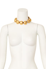 Hammered dome collar necklace with oversized sculptural gold spheres by Lanvin on mannequin @ Recess LA