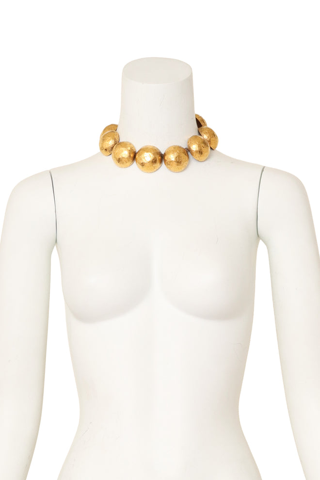 Hammered dome collar necklace with oversized sculptural gold spheres by Lanvin on mannequin @ Recess LA