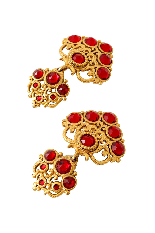 Large ornate crystal drop earrings with layered gold scrollwork and red glass stones by Abbey Road up close @ Recess LA