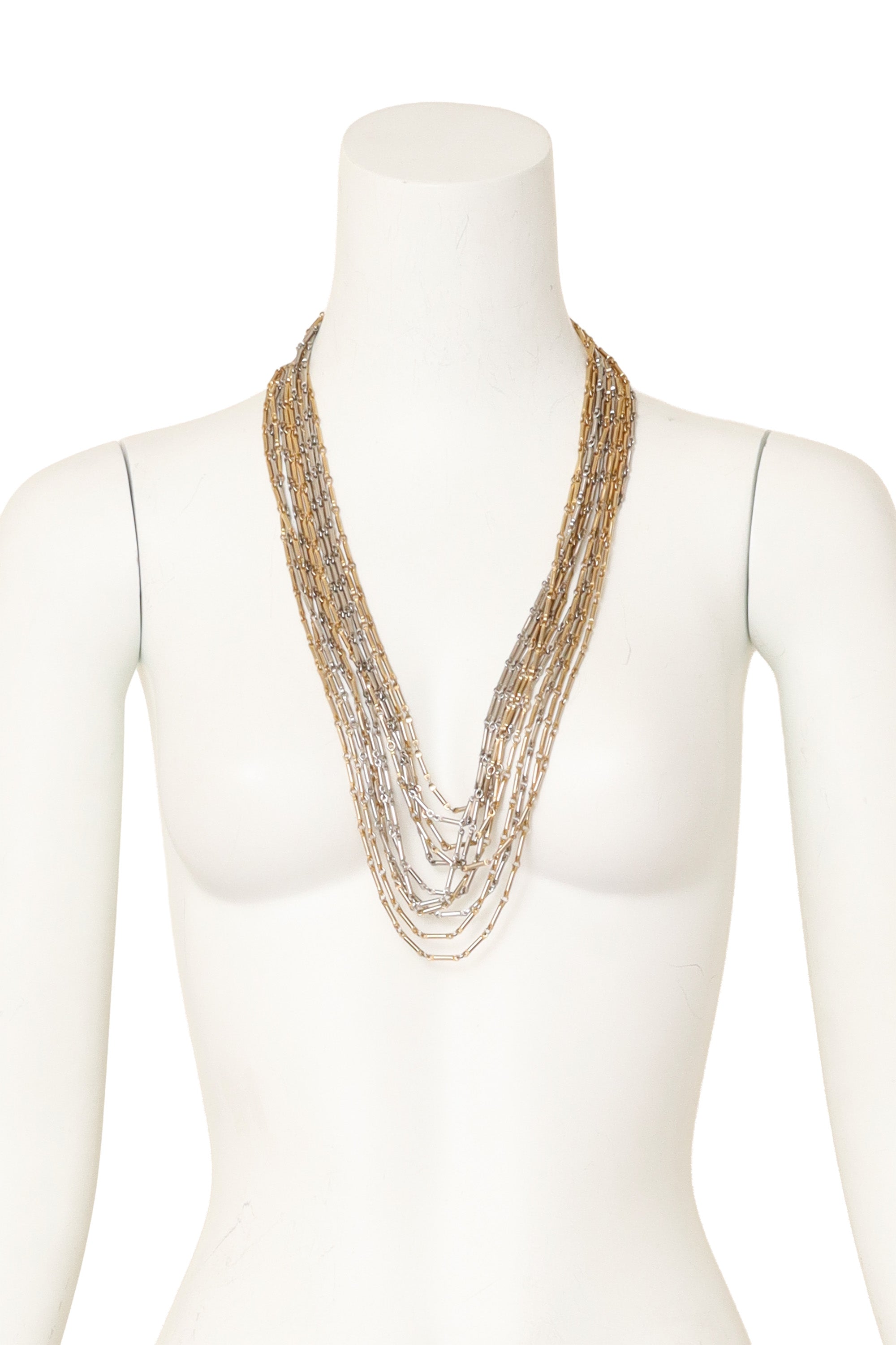 Multi-strand chain necklace with mixed metal links and filigree detailing on mannequin @ Recess LA 