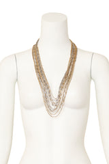 Multi-strand chain necklace with mixed metal links and filigree detailing on mannequin @ Recess LA 