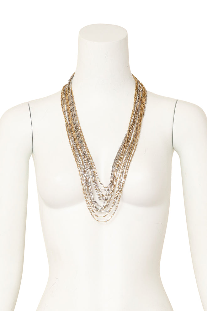 Multi-strand chain necklace with mixed metal links and filigree detailing on mannequin @ Recess LA 