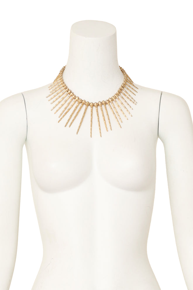Textured bamboo-inspired spike collar necklace in gold tone metal on mannequin @ Recess LA 