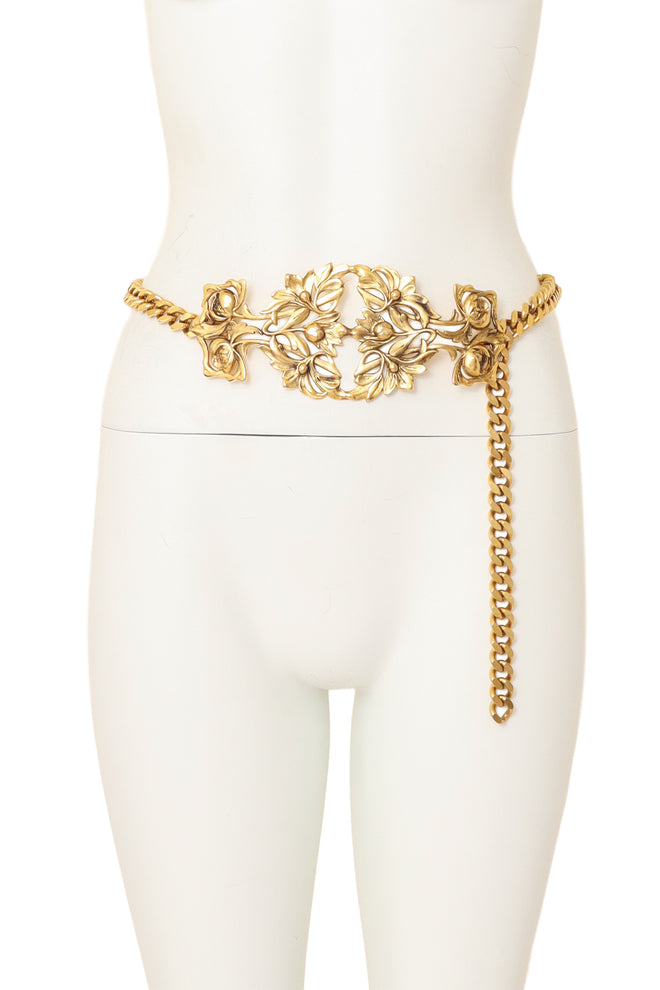 Gold tone chain belt with ornate rose filigree plaque detail on mannequin @ Recess LA 