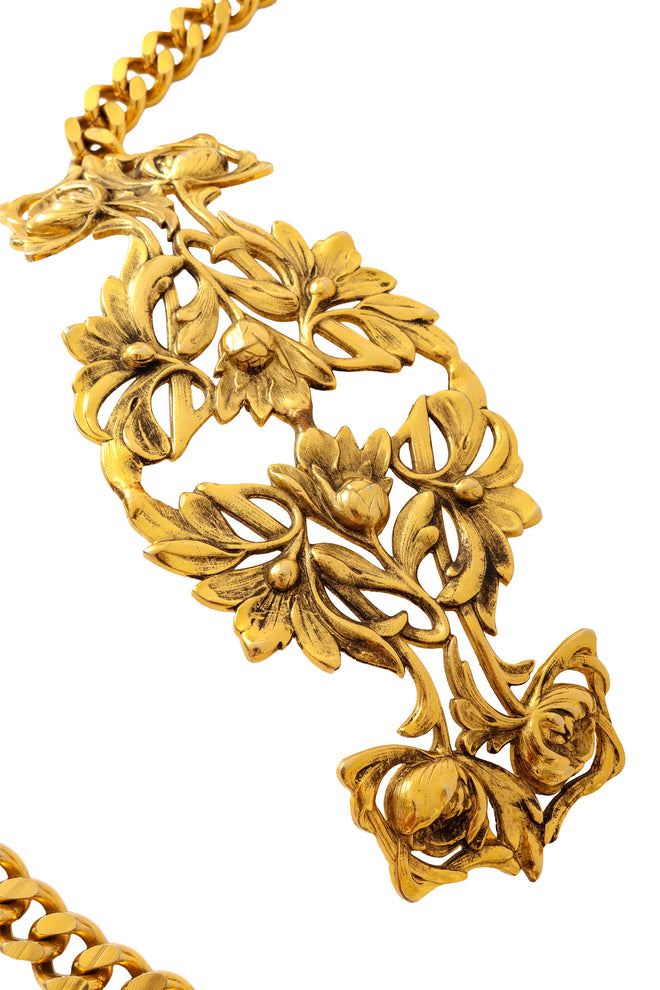 Gold tone chain belt with ornate rose filigree plaque detail buckle up close @ Recess LA 