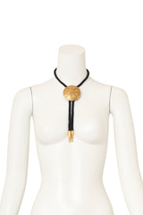 Vintage Yves Saint Laurent Medallion Bolo Tie Necklace on mannequin @ Recess LA