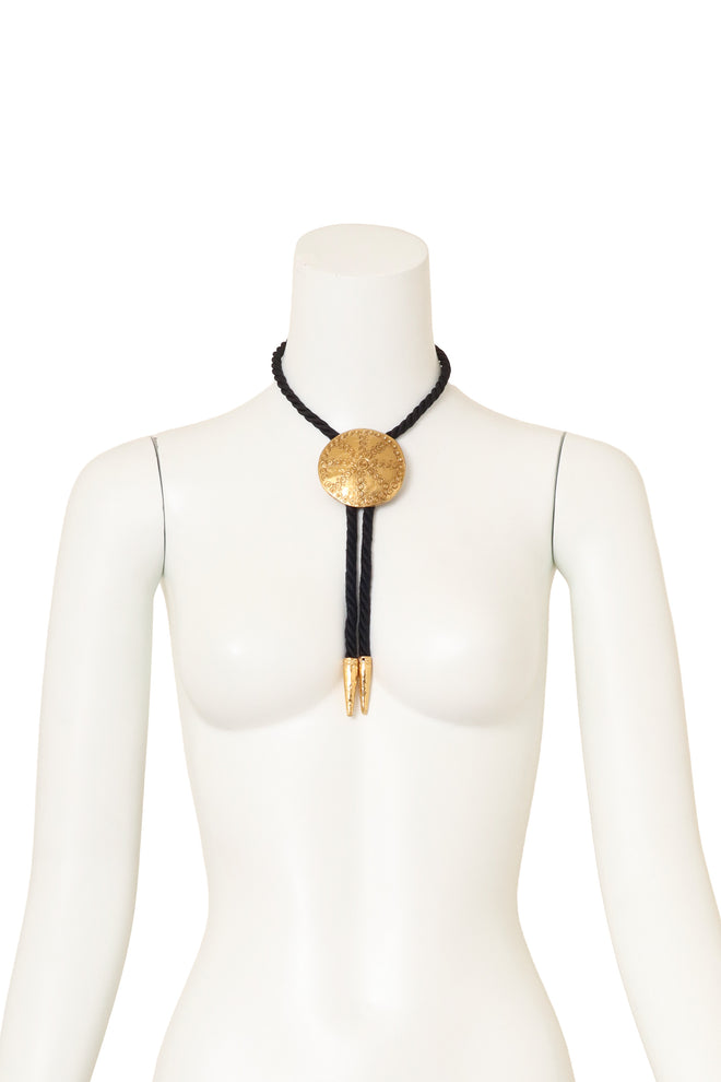Vintage Yves Saint Laurent Medallion Bolo Tie Necklace on mannequin @ Recess LA