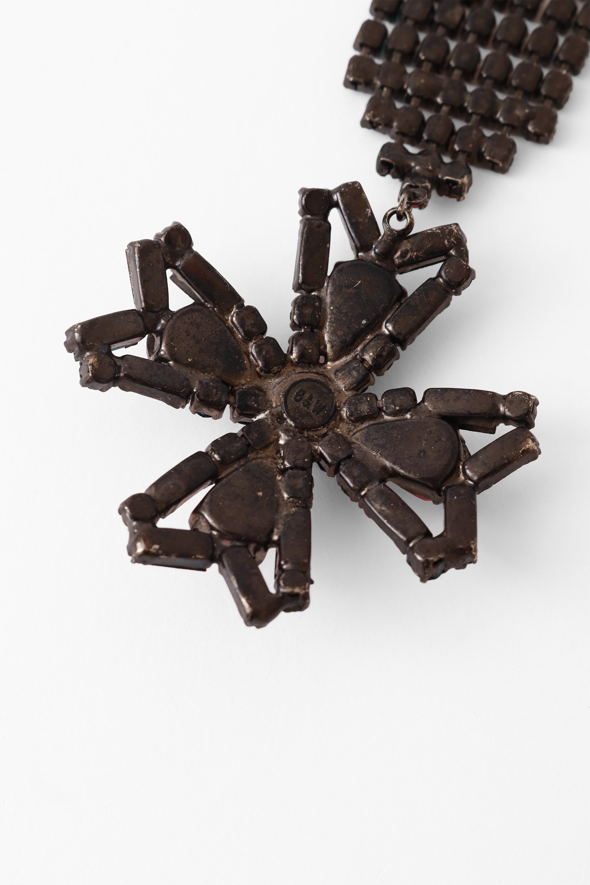 cross brooch by B&W @ Recess LA signature