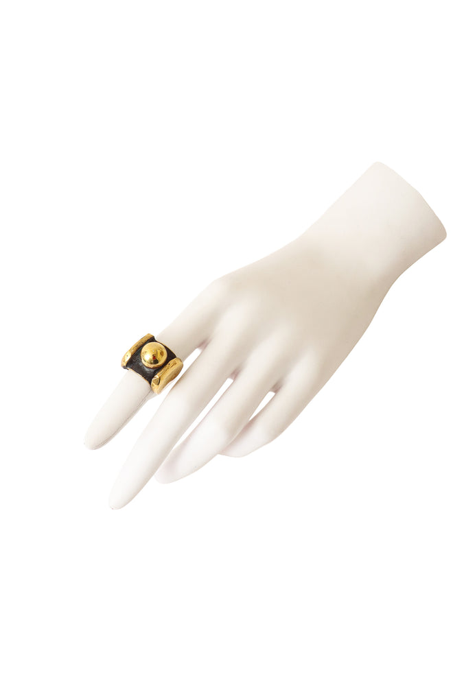 Shiny golden sculptural sphere ring on mannequin @ Recess LA 