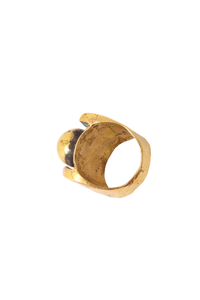 Shiny golden sculptural sphere ring inside @ Recess LA 