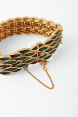 Gold bracelet with green and blue repeating leaf motif by DG back of bracelet @ Recess LA