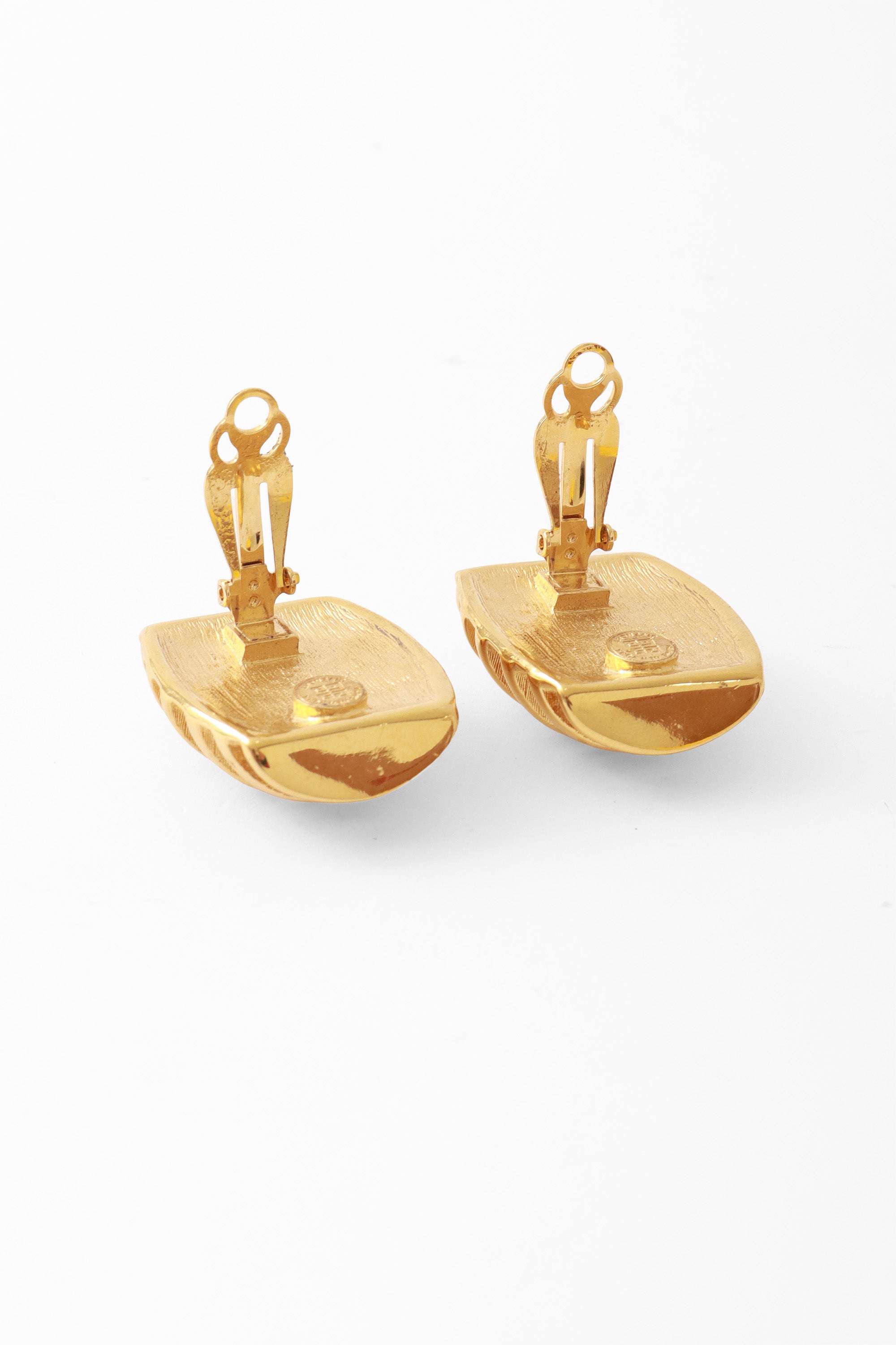 button earrings by Givenchy backs open @ Recess LA