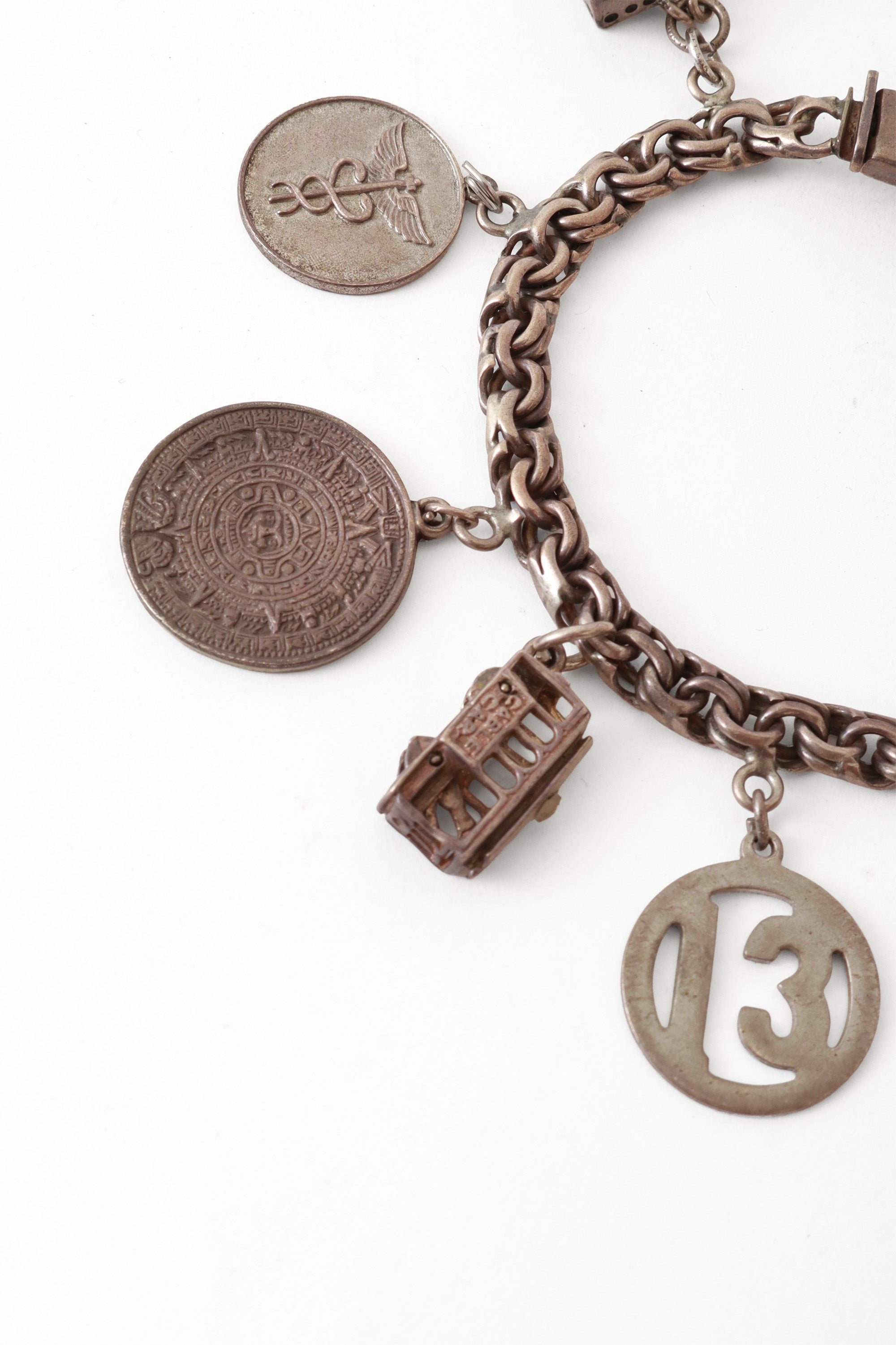 Sterling charm bracelet mayan bus and 13 charms @ Recess LA