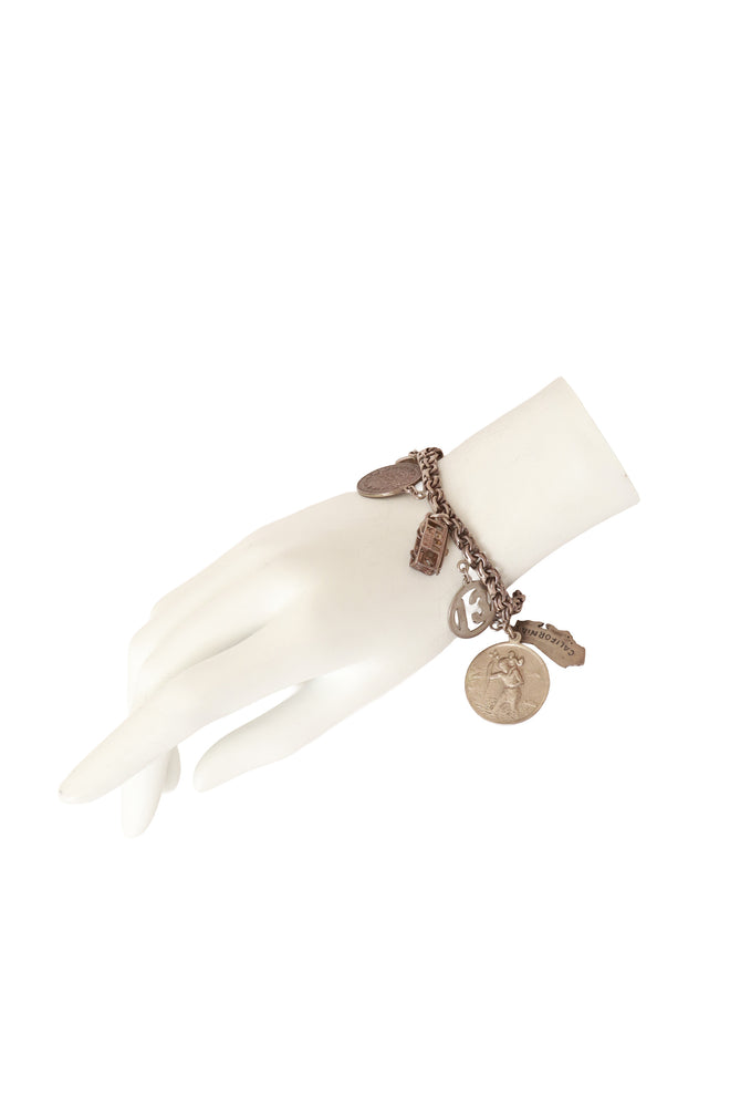 Sterling charm bracelet on mannequin hand @ Recess LA