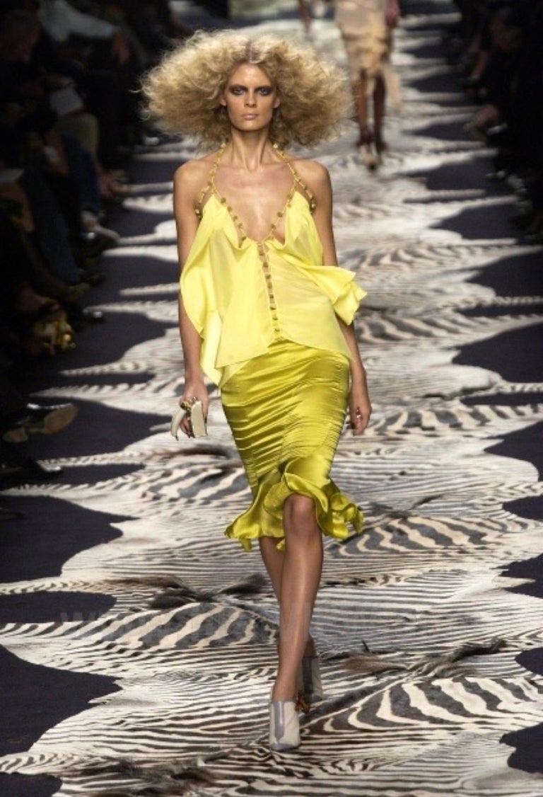 Ruffle hem skirt by Yves Saint Laurent on model on runway from Vogue Archives @recessla