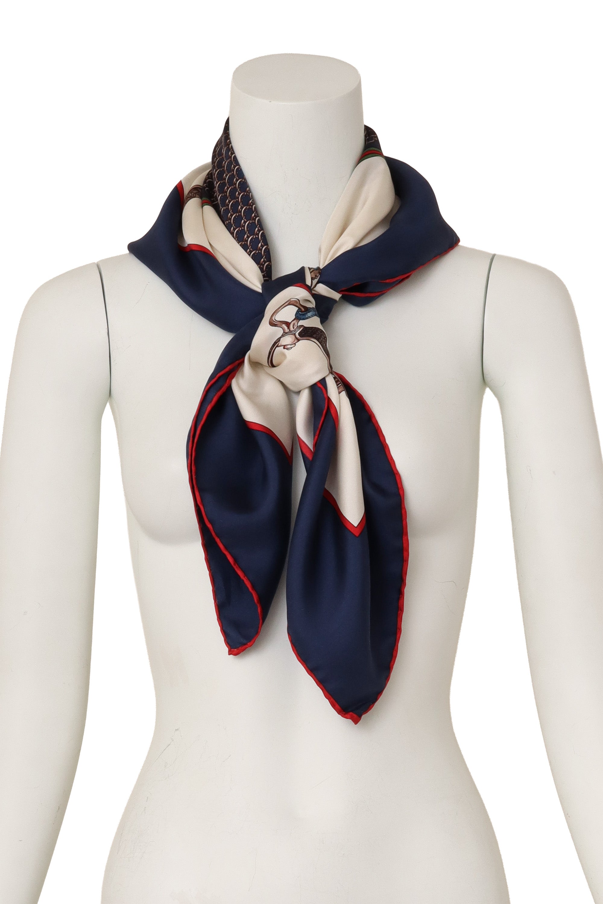Large silk stirrup patterned scarf by Gucci on mannequin @ Recess LA