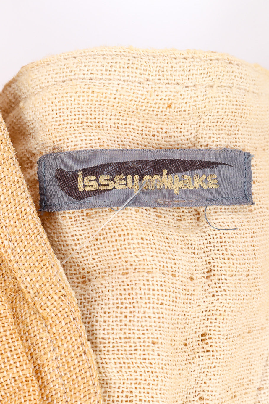 Issey Miyake Flax Linen Pleated Kimono signature label closeup @Recessla
