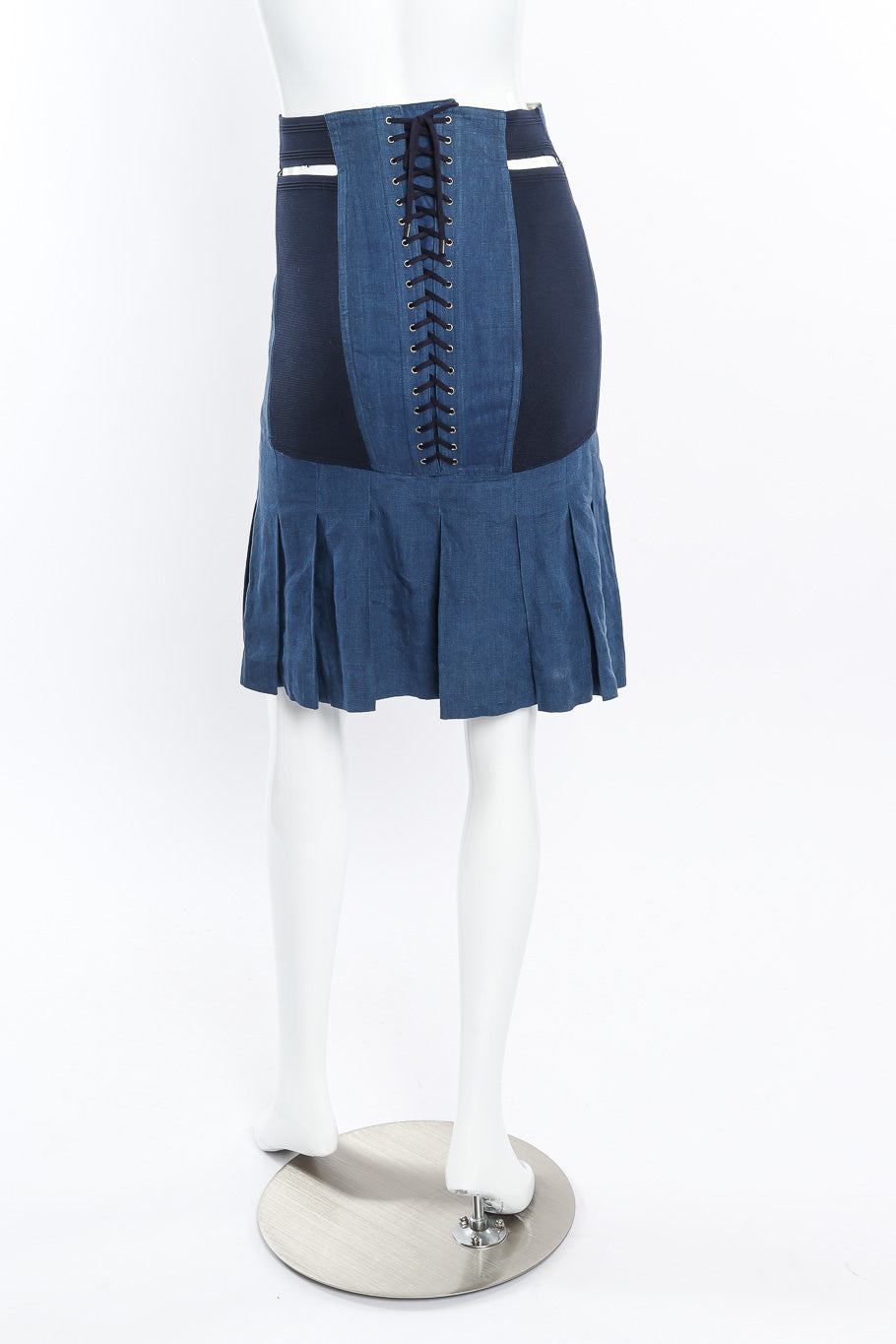 Pleated corset skirt by Jean Paul Gaultier on mannequin back @recessla