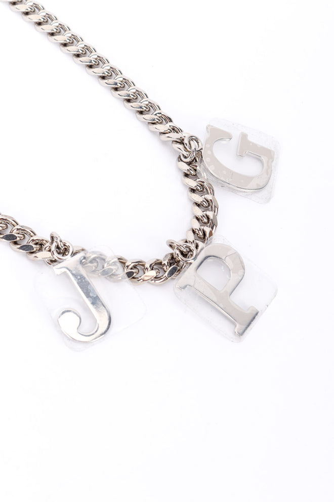 JPG charm necklace by Jean Paul Gaultier on white background taped charms close @recessla