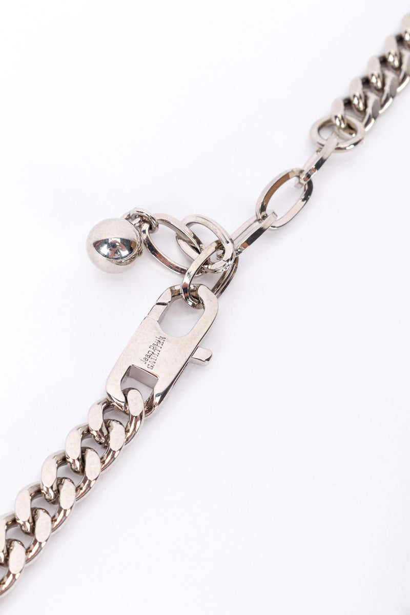 JPG charm necklace by Jean Paul Gaultier on white background clasped close @recessla