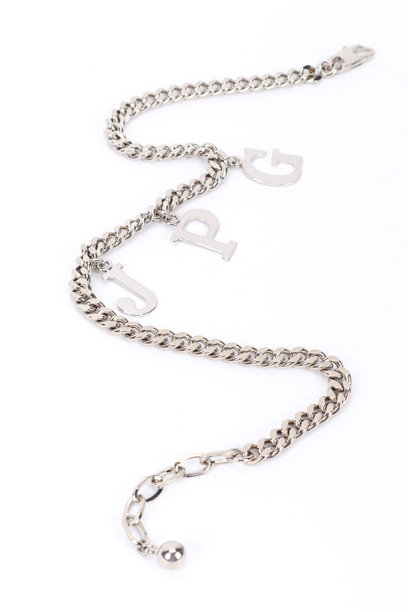 JPG charm necklace by Jean Paul Gaultier on white background in swirl @recessla