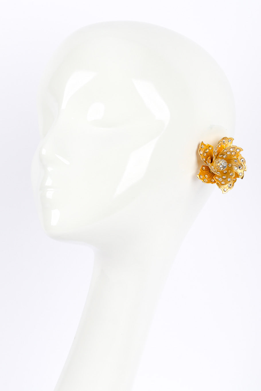 Sculpted flower earrings by James Arpad on white background on mannequin @recessla