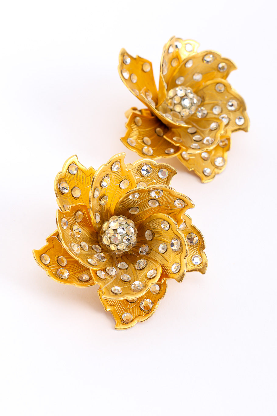 Sculpted flower earrings by James Arpad on white background close @recessla