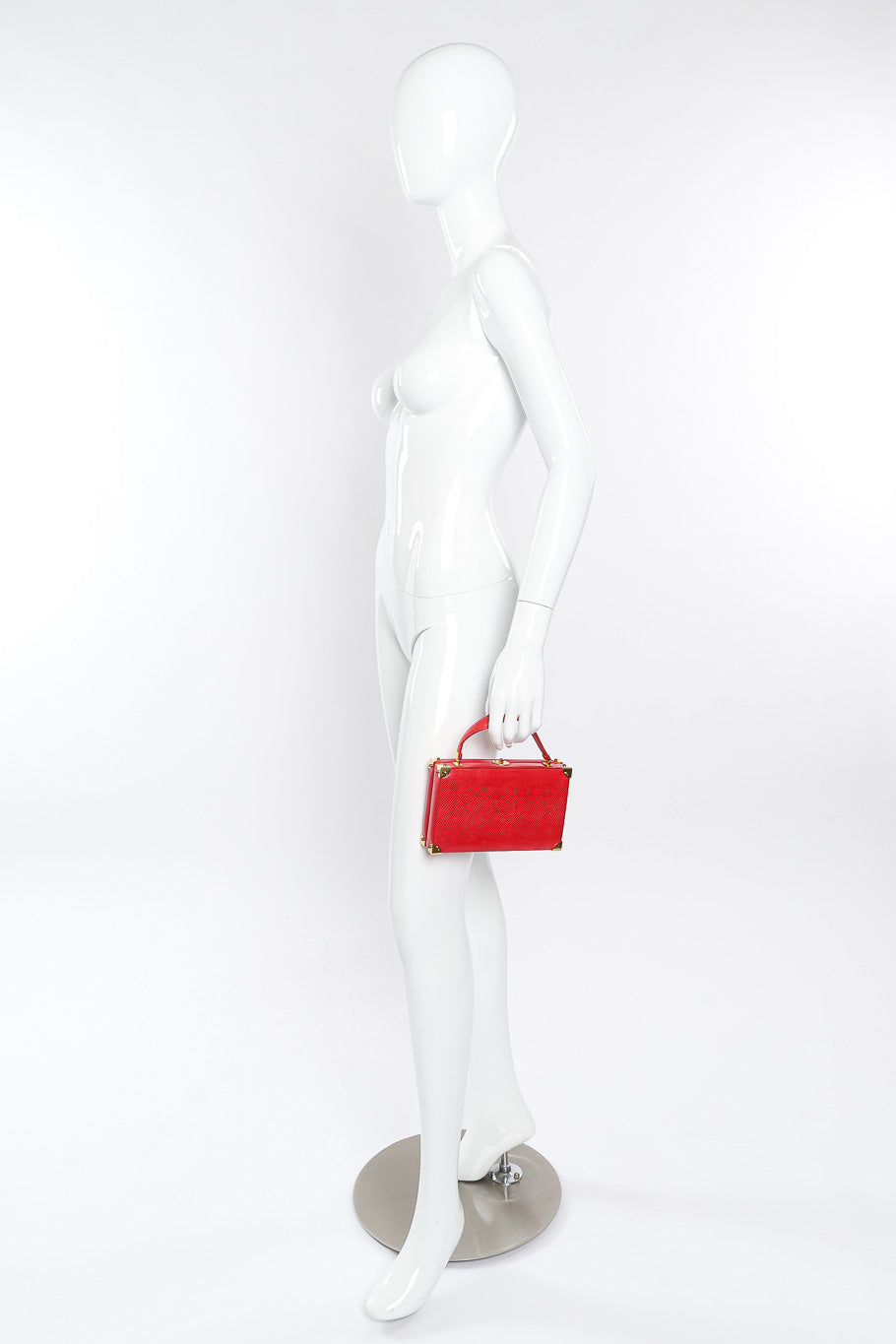 Leather handbag by Judith Leiber held by mannequin @recessla