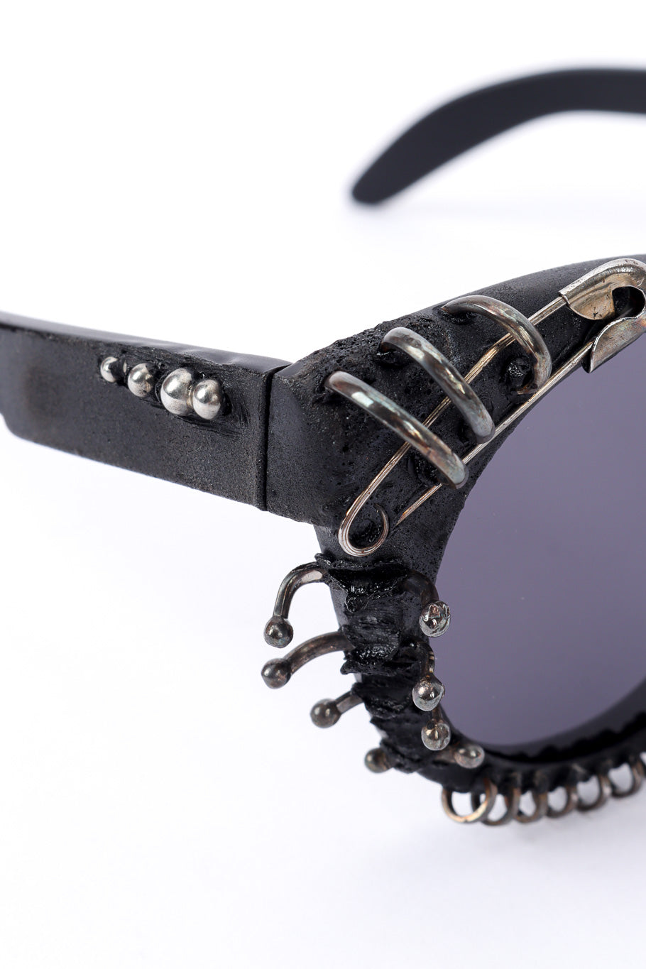 Anarchy sunglasses by Kuboraum on white background stud rings close @recessla