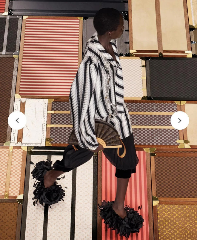 Louis Vuitton Monogram Fan Bag on 2025 runway on model in striped shirt